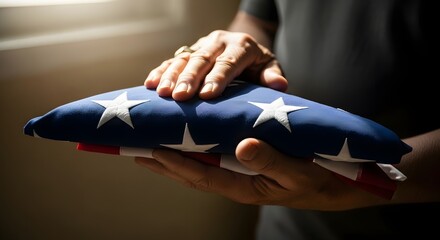 Hands respectfully folding an American flag, symbolizing national pride and remembrance, honoring service members