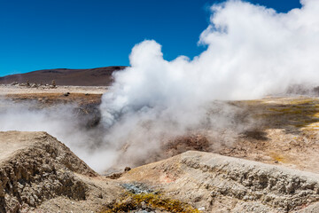 Volcanic fumarole activity at geyser with steam in Sol de Manana (Morning Sun), Andes mountains, Uyuni, Bolivia.