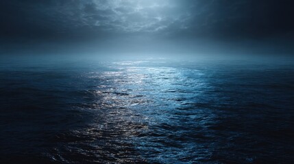Calm dark ocean surface at night under cloudy sky with moonlight reflecting on water, vast blue sea for background