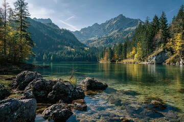 Lush Mountainous Landscape with a Tranquil Lake Reflecting Autumnal Colors Under Clear Sky