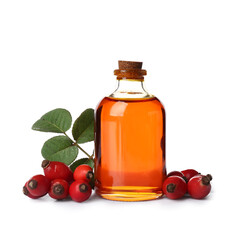 Bottle of cosmetic rose hip oil and berries on white background