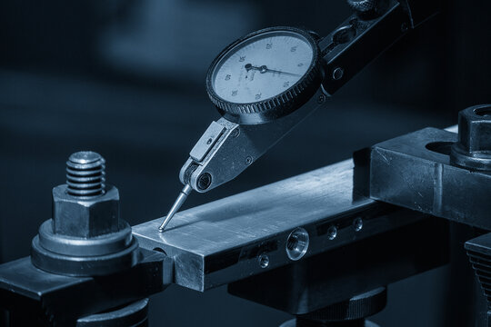 Close up scene the work alignment setup by dial indicator in the blue tone scene.