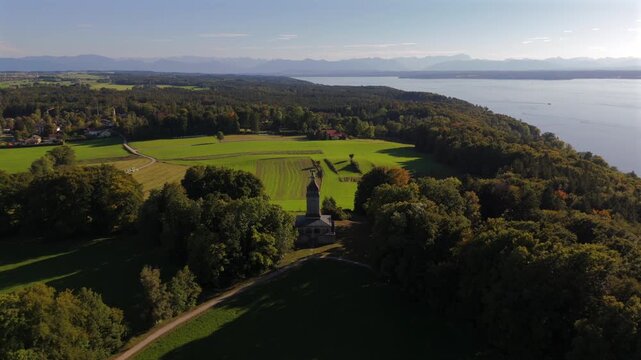 Drone aerial view of Assenhausen Bismarckturm near Munich Bavaria Germany. Scenic lake Starnberg, bronze eagle monument, european destination and travel video.