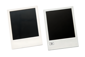 Two blank instant photo frames with white borders and black screens are gently tilted, presented empty and isolated.