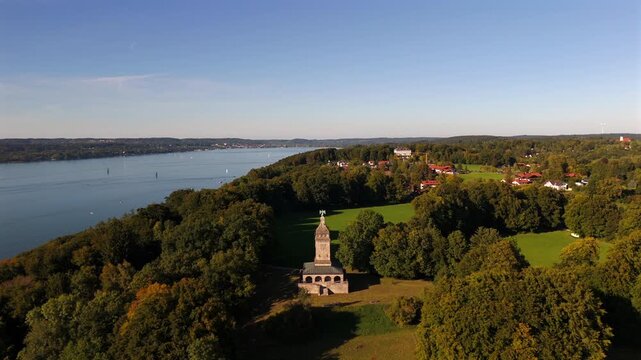 Drone landscape above Starnberger See with Bismarckturm Assenhausen. Aerial Bavaria, historic site, cultural tourism and scenic travel destination near Munich Germany.
