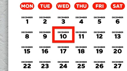 Close-up of the date December 10th marked with a red cursor on the wall calendar 2025