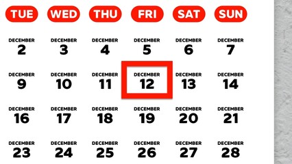 Close-up of the date December 12th marked with a red cursor on the wall calendar 2025