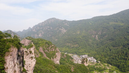 Majestic view of Yandang Mountain cliffs and valley village, Wenzhou, China | 雁荡山悬崖与山谷村落的壮丽景色，中国温州