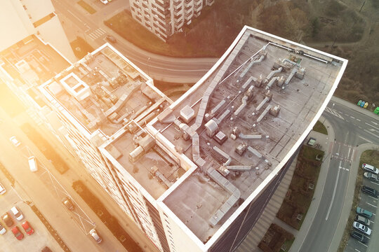 Aerial perspective high-rise building roof infrastructure - Powered by Adobe