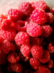 background of fresh ripe raspberries, close up, top view