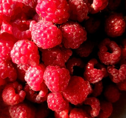 background of fresh ripe raspberries, close up, top view