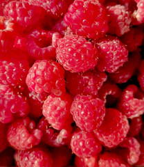 background of fresh ripe raspberries, close up, top view