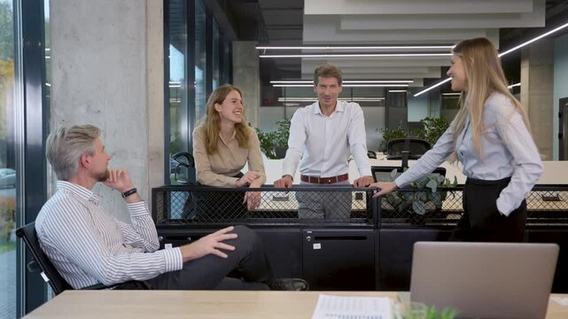 Group of happy progressive business people working on startup together at creative office