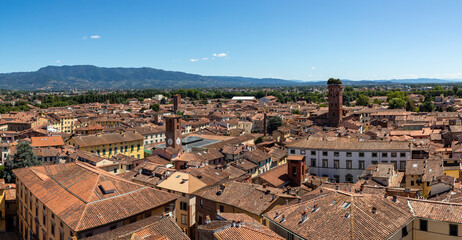panoramic high view of lucca tuscany italy towards the torre guinigi and the mercato del carmine clock tower