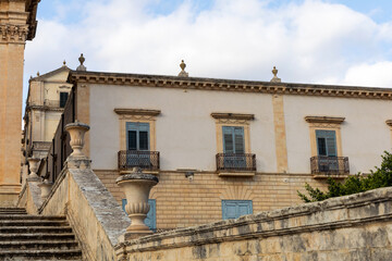 Historic Italian building with balcony and shutters