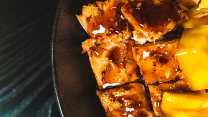 Beautiful poke bowl with grilled salmon, fresh mango, edamame, and glossy sweet-teriyaki sauce. A...