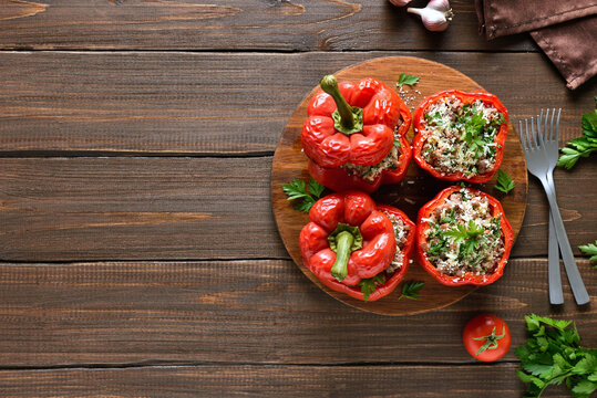 Baked stuffed red bell peppers with minced meat, rice, parmesan
