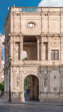 Morning timelapse of Central de Telefonica and the Town Hall in Plaza de San Francisco, Seville. Casa Consistorial, a masterpiece of Plateresque architecture with tram under a blue cloudy sky