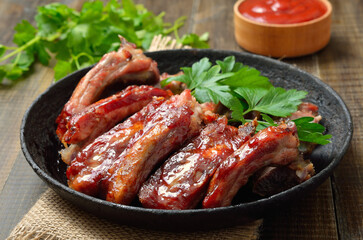 Appetizer roast sliced pork ribs in frying pan