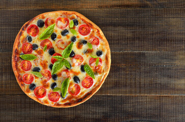 Homemade pizza with tomato and olives