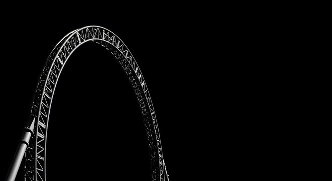 Dramatic black and white view of a roller coaster loop against a solid black background