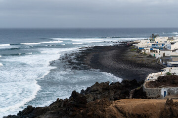 waves crashing on volcanic rocks on Lanzarote