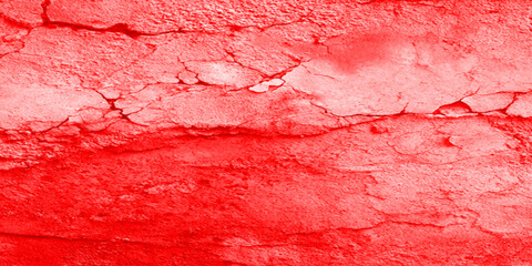 Cracked red wall texture background with rough surface and grunge pattern for abstract design or industrial use.