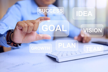 Business strategic concept with businessman hand catch a goal icon represent to set business target to success in competition in the market