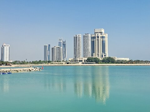View on Skyscrapers and the Moon Tower at Lusail from the Pearl Island in Doha, Qatar