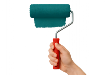 Hand holding a paint roller applying green paint, an art of painting the concept of creation and renovation.