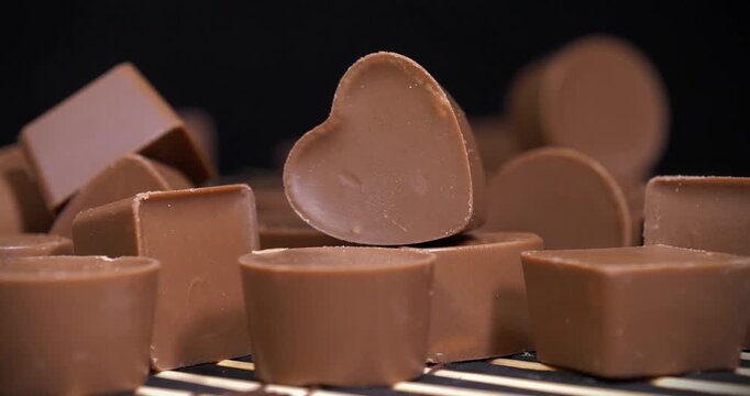 Chocolate candies. Valentines Day Gift. Delicious chocolate candy of different forms, including heart-shaped ones