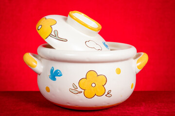 clay cooking pot on a red background