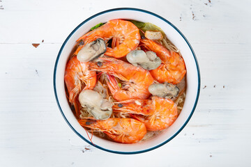 top view fresh seafood rice noodles with shrimps and oysters at horizontal composition