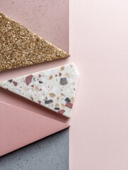 Colorful Geometric Shapes Made of Different Materials Arranged Artistically on a Soft Pastel Background