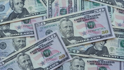 American or US dollars in form of a bunch of fifty and twenty dollar bills - money in the USA
