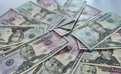American or US dollars in form of a bunch of fifty and twenty dollar bills - money in the USA