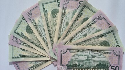 American or US dollars in form of a bunch of fifty and twenty dollar bills - money in the USA