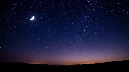 moon and stars glowing in twilight sky
