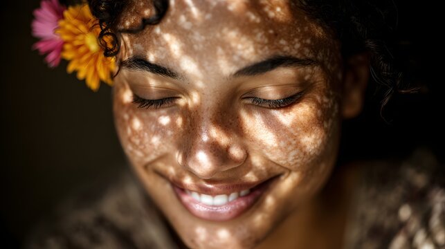 Beautiful woman with natural skin, flower in her hair, and freckles smiles serenely as sunlight dappled her face in a peaceful, quiet moment of reflection