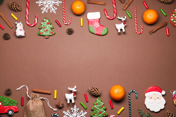 Saint Nicholas day. Different treats and decorations on brown background, flat lay. Space for text