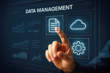 Hand touching digital interface screen displaying data management icons and charts touchscreen finger