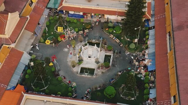 Aerial 4K Drone View of Historic Binh Tay Market Clock Tower, Ho Chi Minh City's Chinatown Landmark
Cholon Chinatown district, showcases a rare blend of traditional Chinese design elements with French