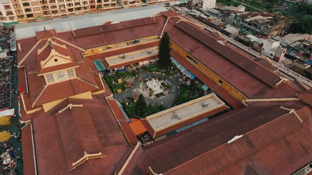 Aerial 4K Drone View of Historic Binh Tay Market Clock Tower, Ho Chi Minh City's Chinatown Landmark
Cholon Chinatown district, showcases a rare blend of traditional Chinese design elements with French