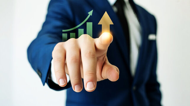 Businessman pointing at a glowing upward trending arrow and bar chart representing financial growth