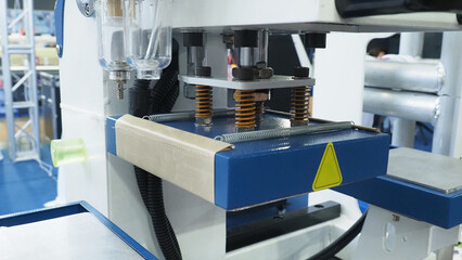 a manufacturing or processing system, likely used for pressing or assembly operations.