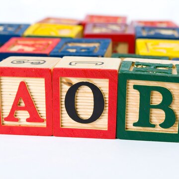 Wooden alphabet blocks spelling AOR