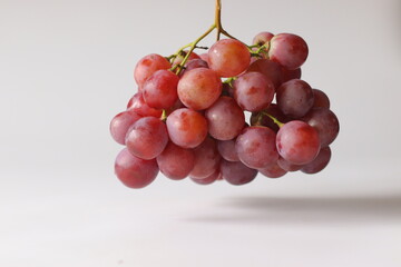 Fresh Red table grapes, likely Red Globe, Crimson Seedless, or Flame Seedless