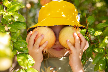 girl picking pomegranates 
