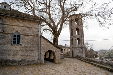 Stone Bell Tower in Church Courtyard with Mountain View in Papingo, Greece