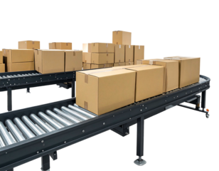 Boxes on conveyor belts, stacked and ready for shipping, against a dark, blurred background